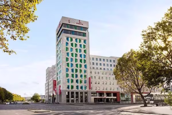 Vienna House Residences by Wyndham modern hotel building with distinctive green facade