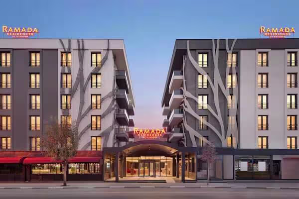 Ramada Residences by Wyndham modern hotel exterior with distinctive red branding